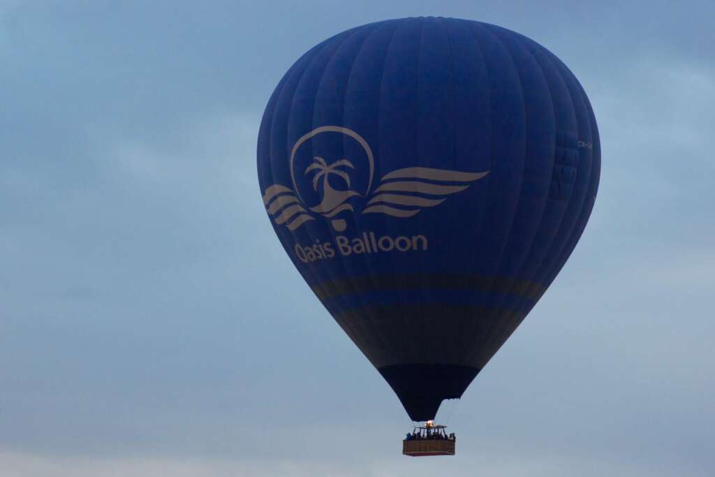 Hot air balloon floating over Marrakech at sunrise with breathtaking views of the Atlas Mountains."
"Aerial view of Marrakech desert landscape from a hot air balloon during sunrise."
"Travelers enjoying a sunrise hot air balloon ride over Morocco’s scenic countryside."
"Golden sunrise over the Atlas Mountains as seen from a hot air balloon in Marrakech."
"Hot air balloons soaring above the Moroccan desert with a stunning sunrise backdrop.