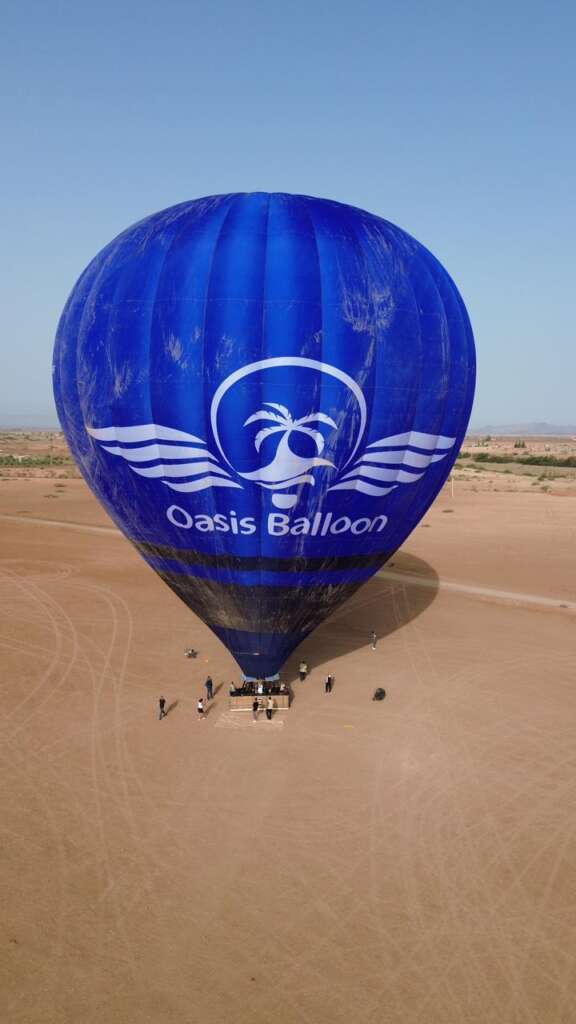 Hot air balloon floating over Marrakech at sunrise with breathtaking views of the Atlas Mountains." "Aerial view of Marrakech desert landscape from a hot air balloon during sunrise." "Travelers enjoying a sunrise hot air balloon ride over Morocco’s scenic countryside." "Golden sunrise over the Atlas Mountains as seen from a hot air balloon in Marrakech." "Hot air balloons soaring above the Moroccan desert with a stunning sunrise backdrop